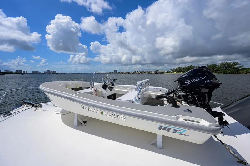 Alli-gator Yacht Photos Pics Small boat on a Viking 50 Convertible yacht, 2000 model, with Tohatsu outboard motor.