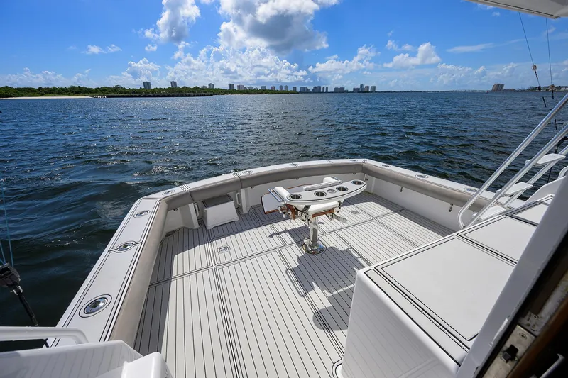Alli-gator Yacht Photos Pics Viking 50 Convertible 2000 yacht deck overlooking ocean and distant city skyline.