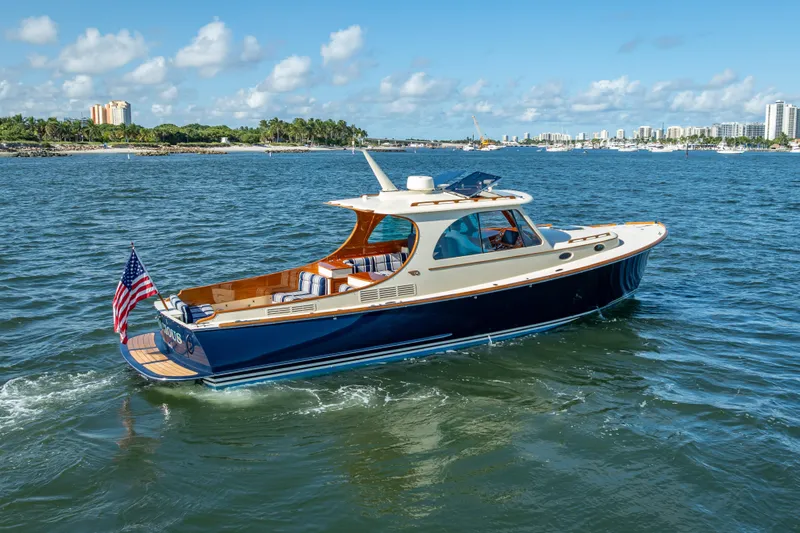 Gracious Yacht Photos Pics 2018 Hinckley Picnic Boat 37 MKIII cruising on a sunny day with city skyline backdrop.