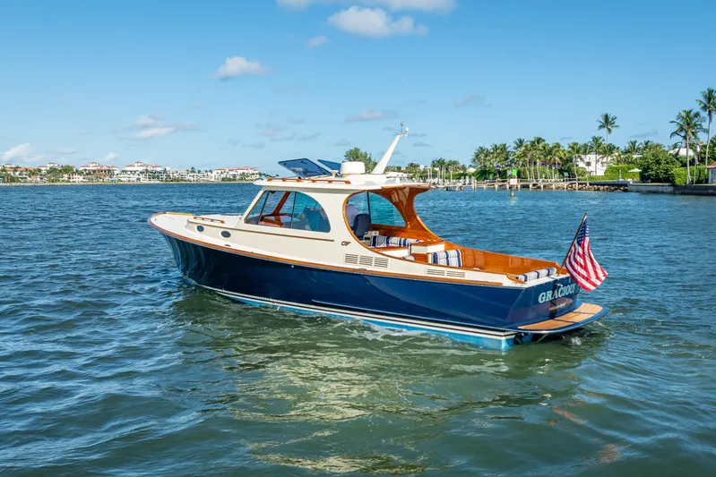 Gracious Yacht Photos Pics 2018 Hinckley Picnic Boat 37 MKIII cruising on a sunny day, American flag displayed.