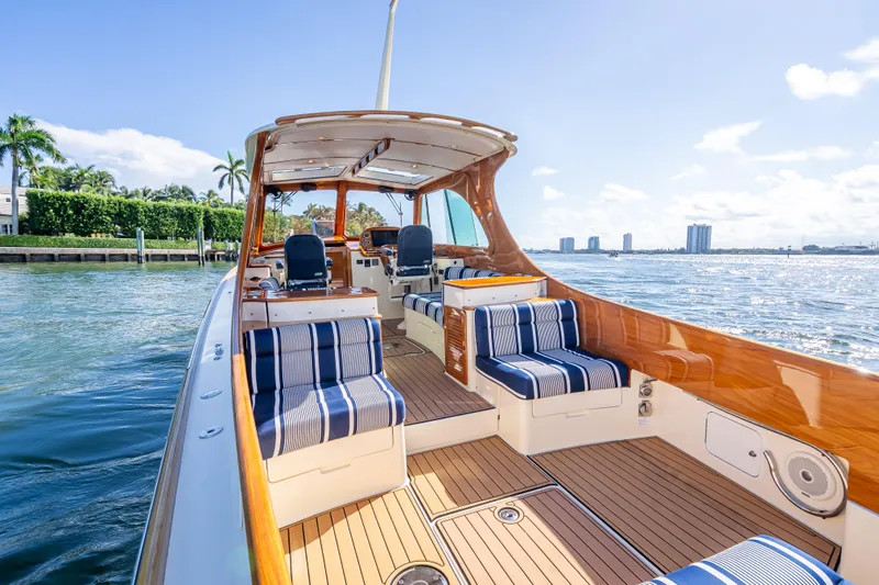 Gracious Yacht Photos Pics 2018 Hinckley Picnic Boat 37 MKIII with elegant seating, cruising on sunny waters.