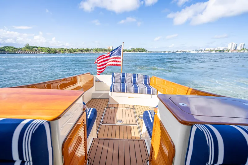Gracious Yacht Photos Pics 2018 Hinckley Picnic Boat 37 MKIII on water, featuring elegant deck and seating.