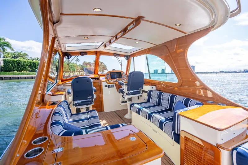 Gracious Yacht Photos Pics Luxurious 2018 Hinckley Picnic Boat 37 MKIII interior with elegant seating and scenic water view.