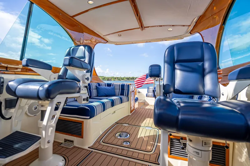 Gracious Yacht Photos Pics 2018 Hinckley Picnic Boat 37 MKIII interior with blue seating and American flag.