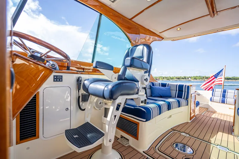 Gracious Yacht Photos Pics 2018 Hinckley Picnic Boat 37 MKIII interior with luxurious seating and American flag.