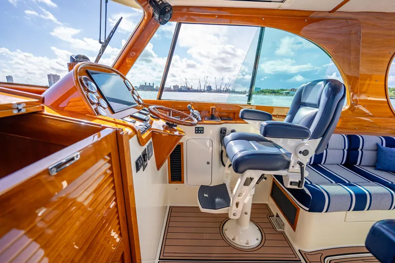 Gracious Yacht Photos Pics 2018 Hinckley Picnic Boat 37 MKIII interior with luxurious seating and polished wood finish.