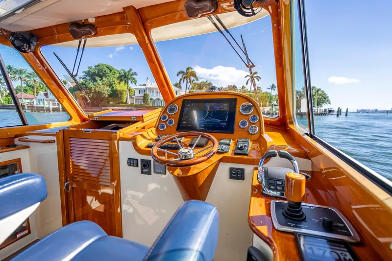 Gracious Yacht Photos Pics 2018 Hinckley Picnic Boat 37 MKIII helm with luxurious wood finish and modern controls.