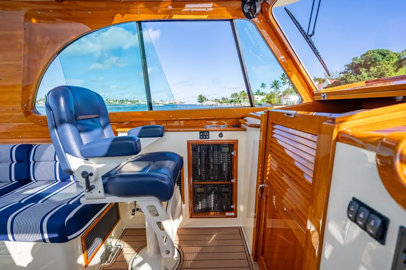 Gracious Yacht Photos Pics Interior of 2018 Hinckley Picnic Boat 37 MKIII with luxurious seating and wood finish.