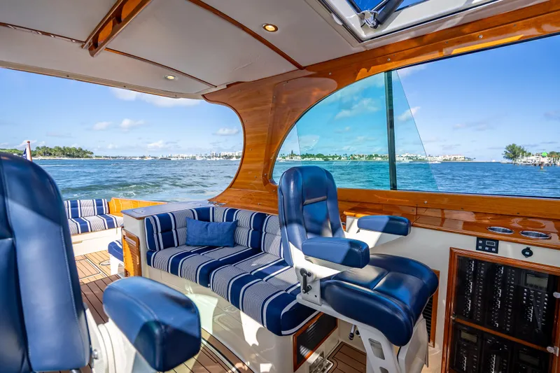 Gracious Yacht Photos Pics Interior of 2018 Hinckley Picnic Boat 37 MKIII with blue seating and ocean view.