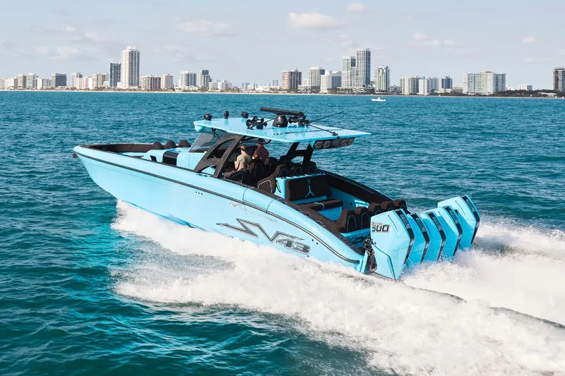  Yacht Photos Pics 2024 Midnight Express 43' Solstice boat cruising on blue ocean near city skyline.