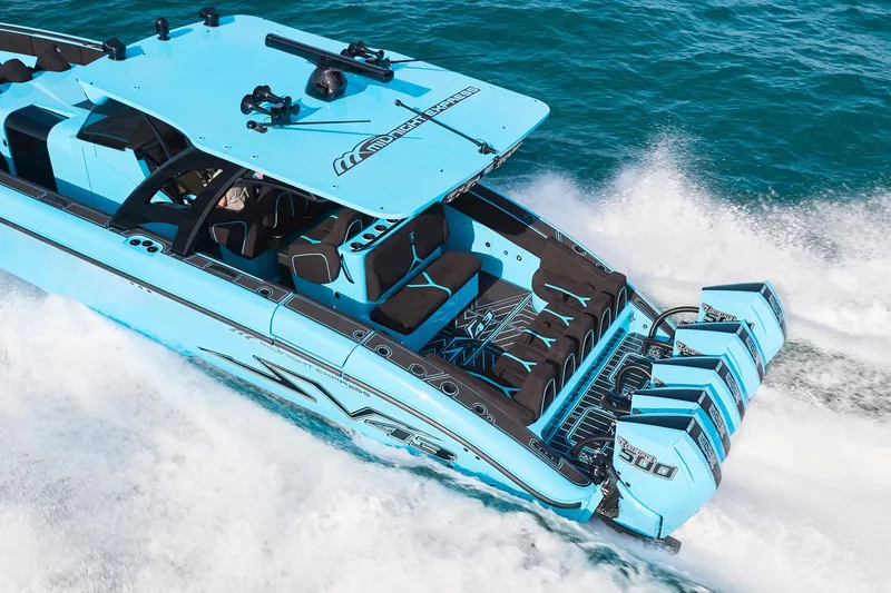  Yacht Photos Pics 2024 Midnight Express 43' Solstice speedboat cruising on ocean waves.