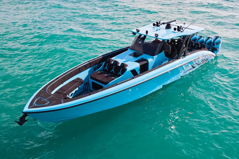  Yacht Photos Pics 2024 Midnight Express 43' Solstice boat on turquoise water, showcasing sleek design and luxury features.