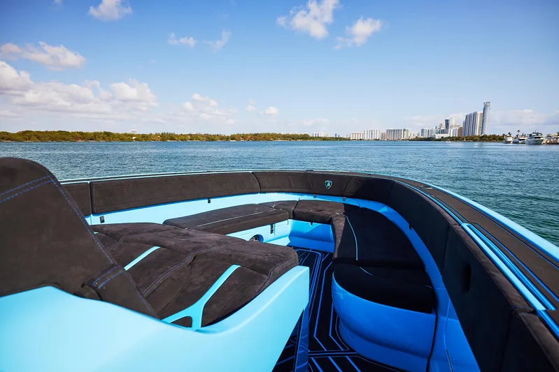  Yacht Photos Pics 2024 Midnight Express 43' Solstice luxury boat on serene water with city skyline.