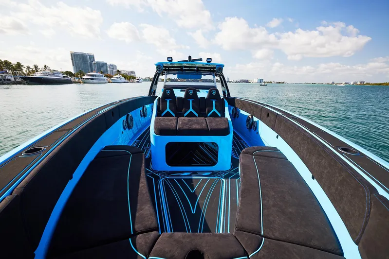  Yacht Photos Pics 2024 Midnight Express 43' Solstice luxury boat on calm water, featuring sleek design and vibrant colors.