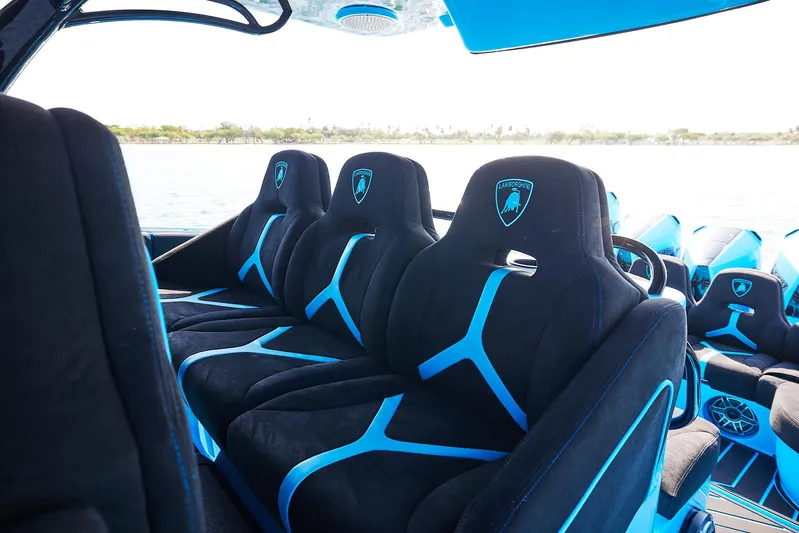  Yacht Photos Pics Luxurious interior of 2024 Midnight Express 43' Solstice boat with sleek black and blue seating.