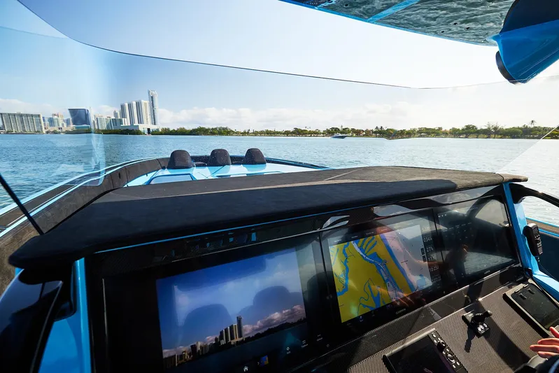  Yacht Photos Pics Interior view of 2024 Midnight Express 43' Solstice boat with navigation screens.