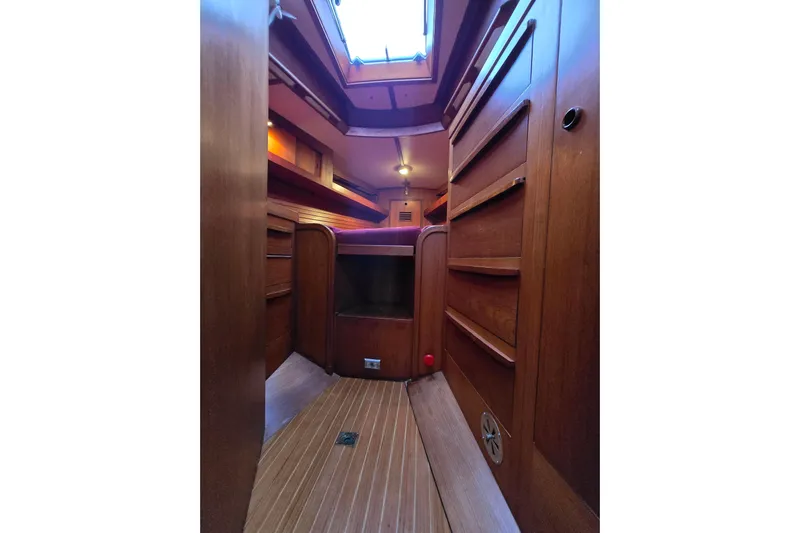Simplicity Yacht Photos Pics Interior of 1986 Cambria 46 sailboat with wooden cabinetry and skylight.