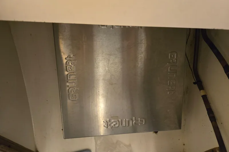 Simplicity Yacht Photos Pics Grunert metal panel in 1986 Cambria 46 model, showcasing industrial design.