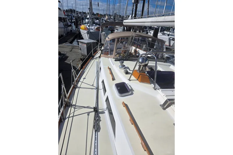 Simplicity Yacht Photos Pics 1986 Cambria 46 sailboat docked at marina, showcasing deck and rigging.