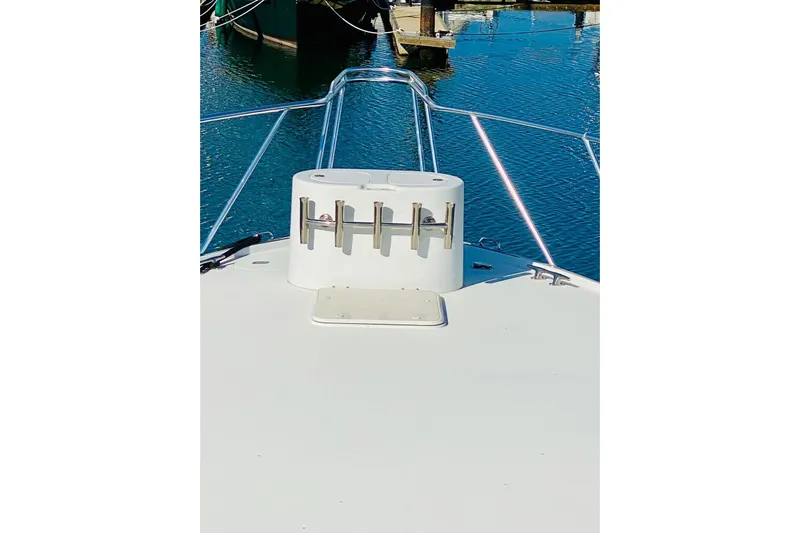  Yacht Photos Pics Bow view of 2001 Hatteras 60 Convertible yacht with rod holders.