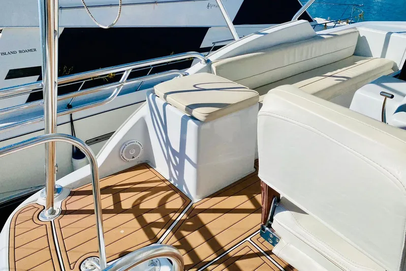  Yacht Photos Pics Luxurious seating area on a 2001 Hatteras 60 Convertible yacht deck.