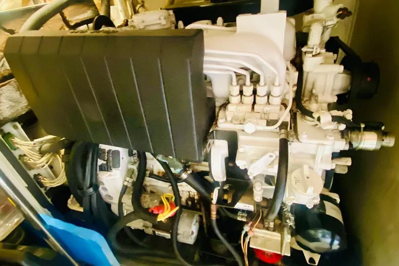  Yacht Photos Pics Engine compartment of a 2001 Hatteras 60 Convertible yacht, showcasing mechanical components.