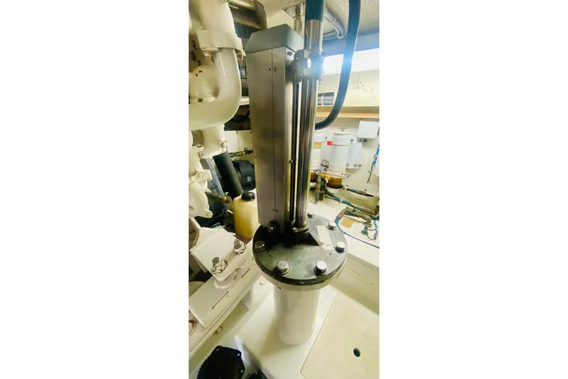  Yacht Photos Pics Engine room of 2001 Hatteras 60 Convertible yacht, showcasing mechanical components.