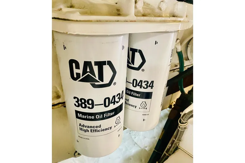  Yacht Photos Pics CAT marine oil filters in a 2001 Hatteras 60 Convertible engine room.