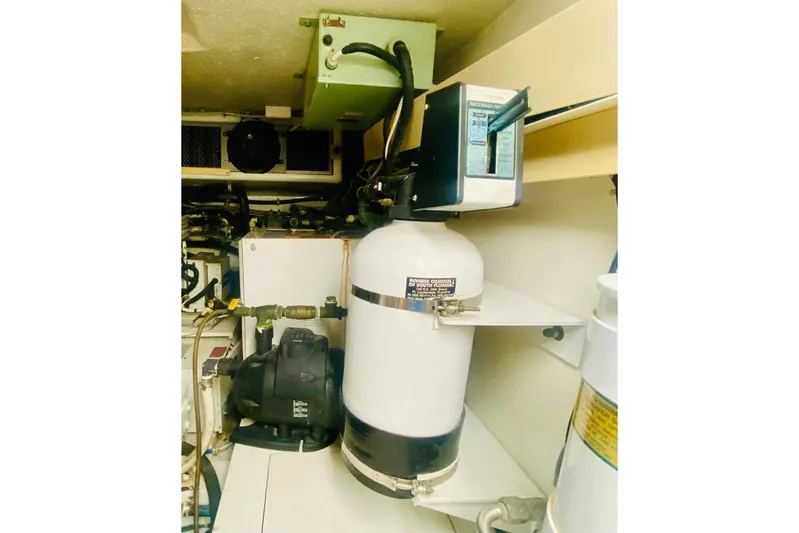  Yacht Photos Pics Engine room of 2001 Hatteras 60 Convertible yacht, featuring mechanical equipment and systems.