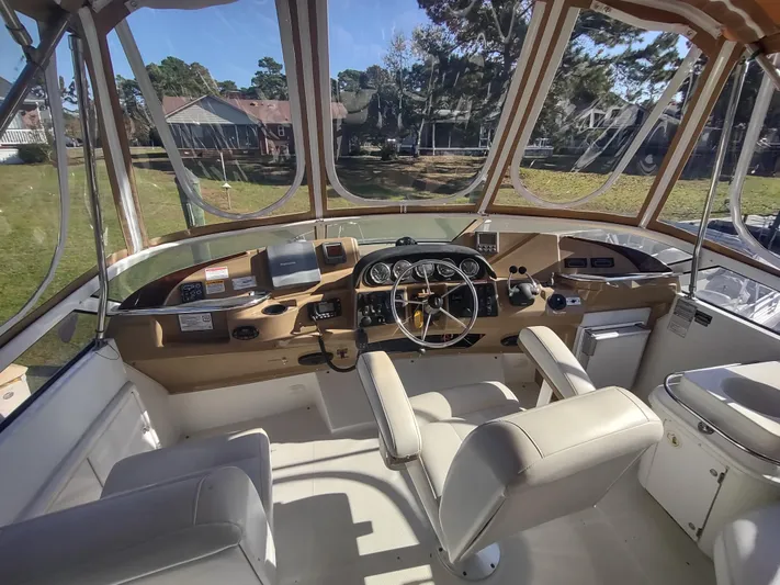  Yacht Photos Pics Interior view of 2004 Carver 366 Motor Yacht helm with steering wheel and controls.