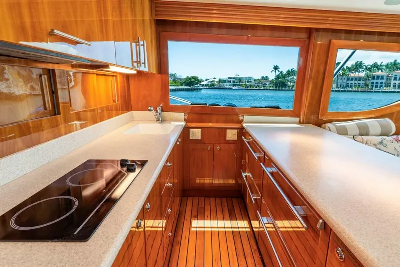 My Girl Yacht Photos Pics Luxurious kitchen interior of 2005 Hatteras 50 Convertible Sportfish yacht with waterfront view.