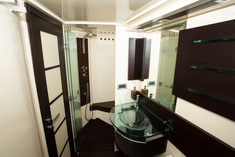  Yacht Photos Pics Luxurious bathroom interior of 2008 Azimut 62S yacht with modern glass sink and shower.