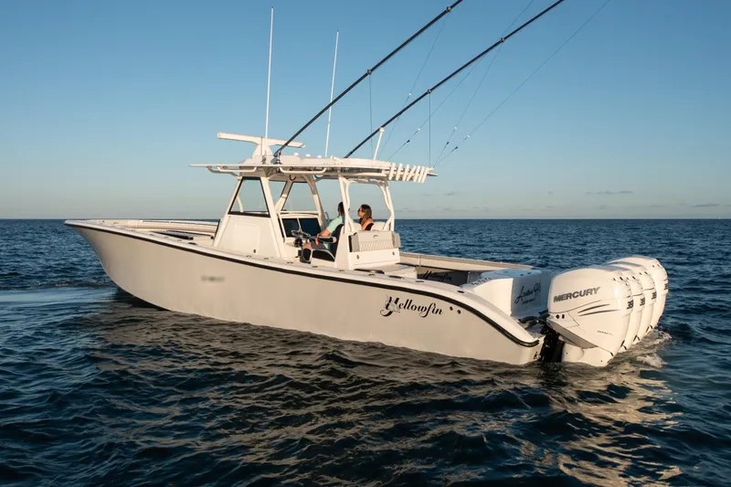  Yacht Photos Pics 2019 Yellowfin 39 Offshore boat cruising on open water at sunset.