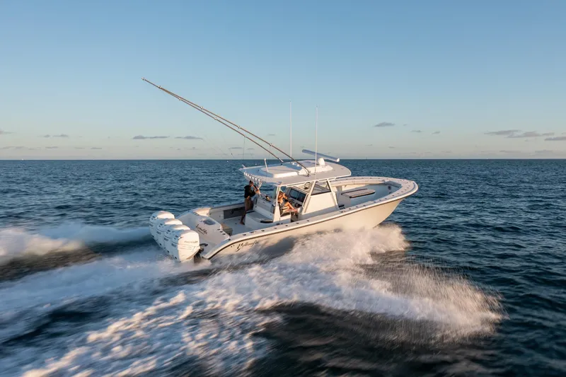  Yacht Photos Pics 2019 Yellowfin 39 Offshore boat cruising on open water at sunset.