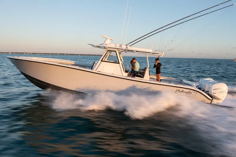  Yacht Photos Pics 2019 Yellowfin 39 Offshore boat cruising on open water at sunset.