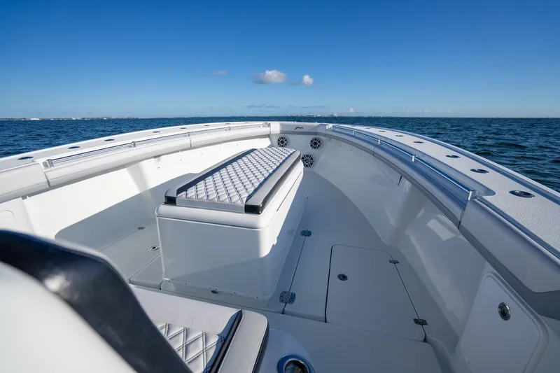  Yacht Photos Pics 2019 Yellowfin 39 Offshore boat interior with seating, on calm ocean waters.
