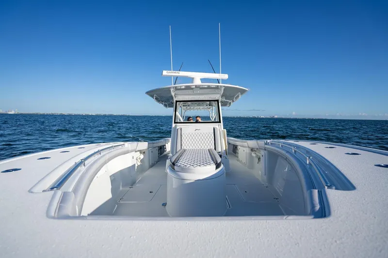  Yacht Photos Pics 2019 Yellowfin 39 Offshore boat cruising on open water under clear blue sky.