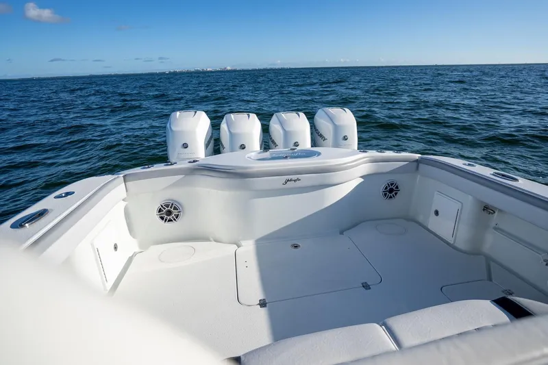  Yacht Photos Pics 2019 Yellowfin 39 Offshore boat with triple engines on open sea.