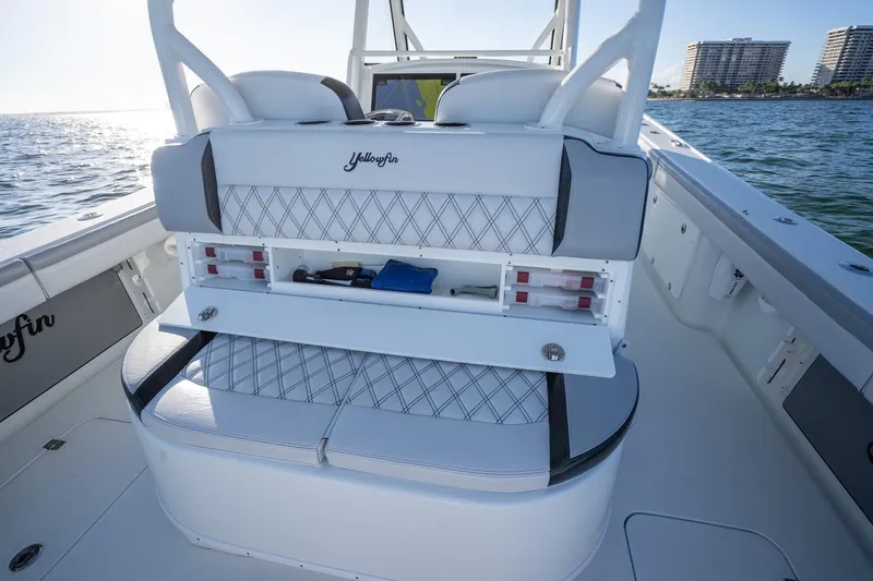  Yacht Photos Pics 2019 Yellowfin 39 Offshore boat interior with storage compartment open, ocean view in background.