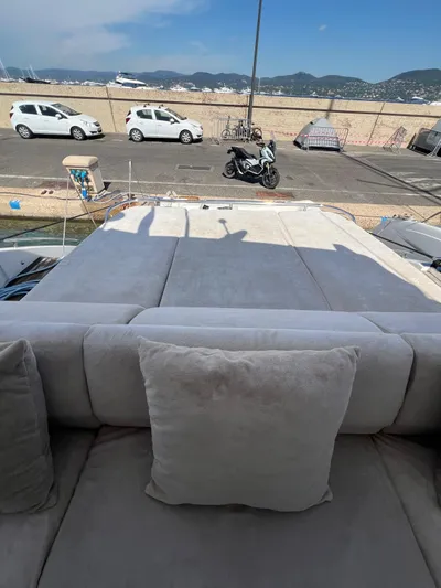  Yacht Photos Pics Luxurious 2011 Princess V62 yacht with spacious sunbathing area and scenic coastal view.