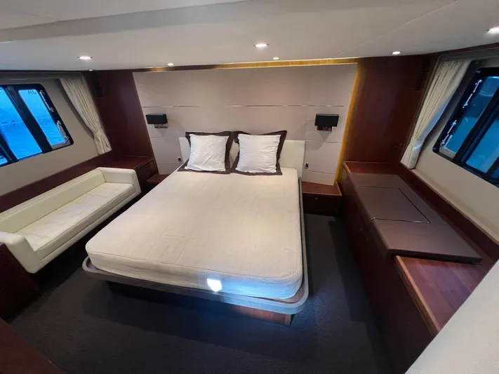  Yacht Photos Pics Luxurious bedroom interior of 2011 Princess V62 yacht with modern design and cozy ambiance.