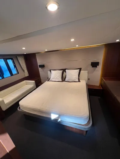  Yacht Photos Pics Luxurious bedroom interior of 2011 Princess V62 yacht with modern design and cozy ambiance.