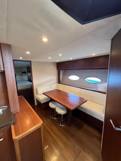  Yacht Photos Pics Luxurious interior of 2011 Princess V62 yacht with elegant dining area and wooden finishes.