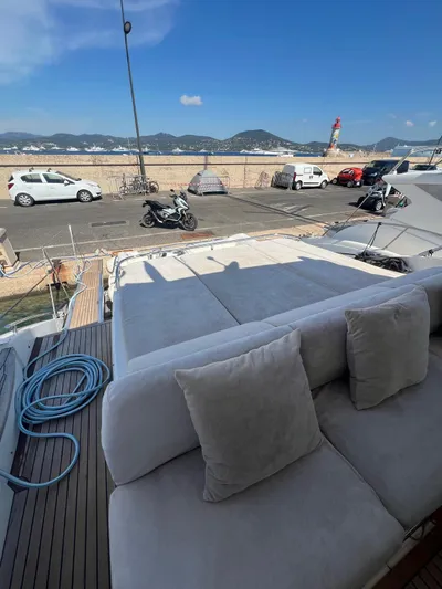  Yacht Photos Pics Luxurious 2011 Princess V62 yacht with spacious deck, docked at scenic marina.