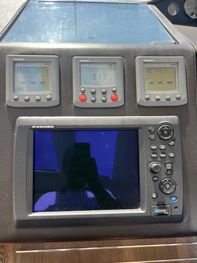  Yacht Photos Pics Control panel of a 2011 Princess V62 yacht with navigation displays.