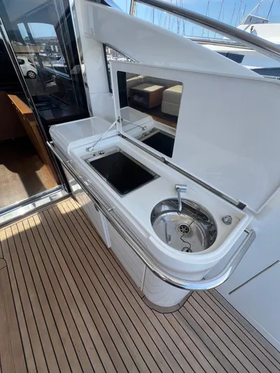  Yacht Photos Pics Outdoor kitchenette on 2011 Princess V62 yacht with sink and grill.
