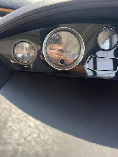  Yacht Photos Pics Dashboard of a 2011 Princess V62 yacht, featuring analog gauges and a sleek design.