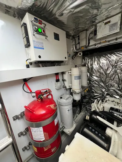  Yacht Photos Pics Engine room of 2011 Princess V62 yacht with fire extinguisher and control panel.