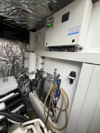  Yacht Photos Pics Engine room of a 2011 Princess V62 yacht with various mechanical components.