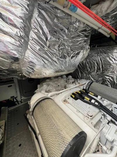  Yacht Photos Pics Engine room of a 2011 Princess V62 yacht with insulated components and filters.